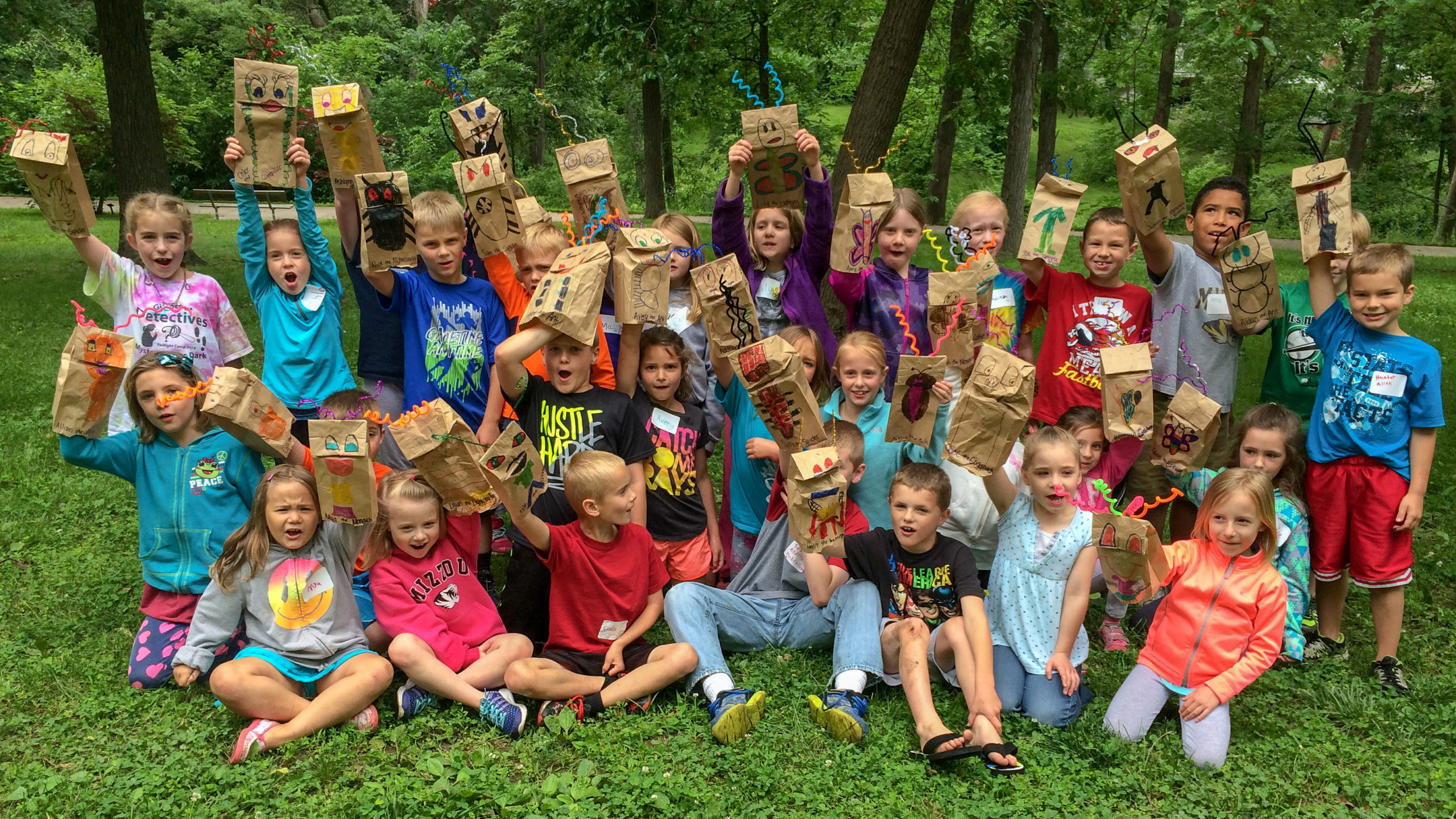 Group of campers with paper bag puppets
