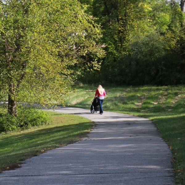 Woman Walking on Fitness Look with Stroller