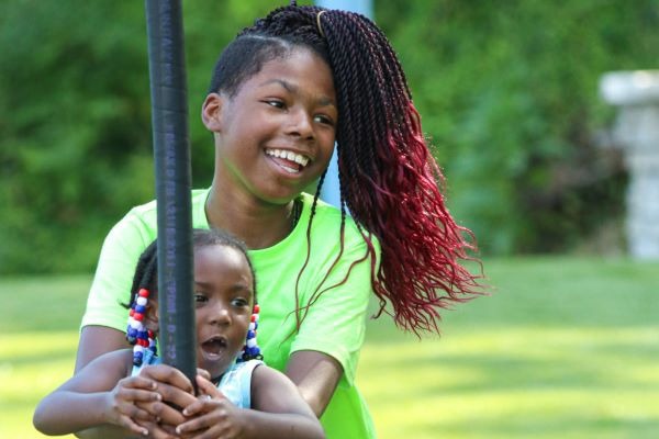 two kids playing at community park